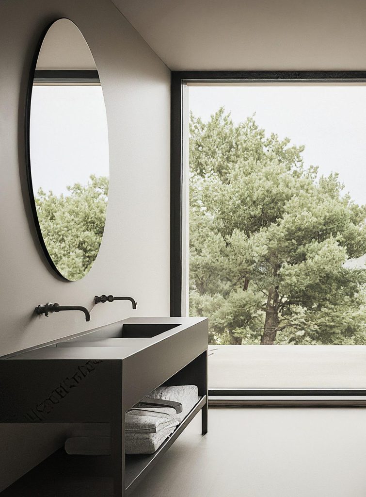 Why might you purchase a round bathroom mirror?