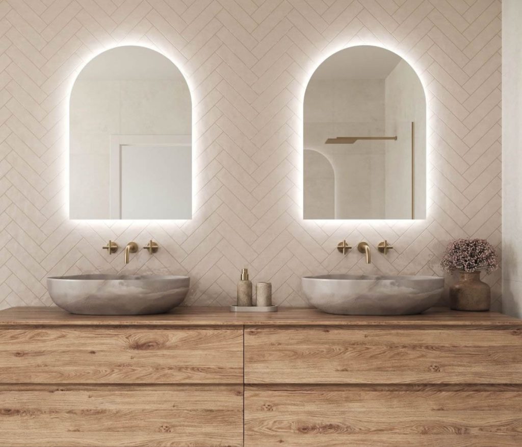 For what reasons might an arch-shaped mirror be the best choice for your bathroom?