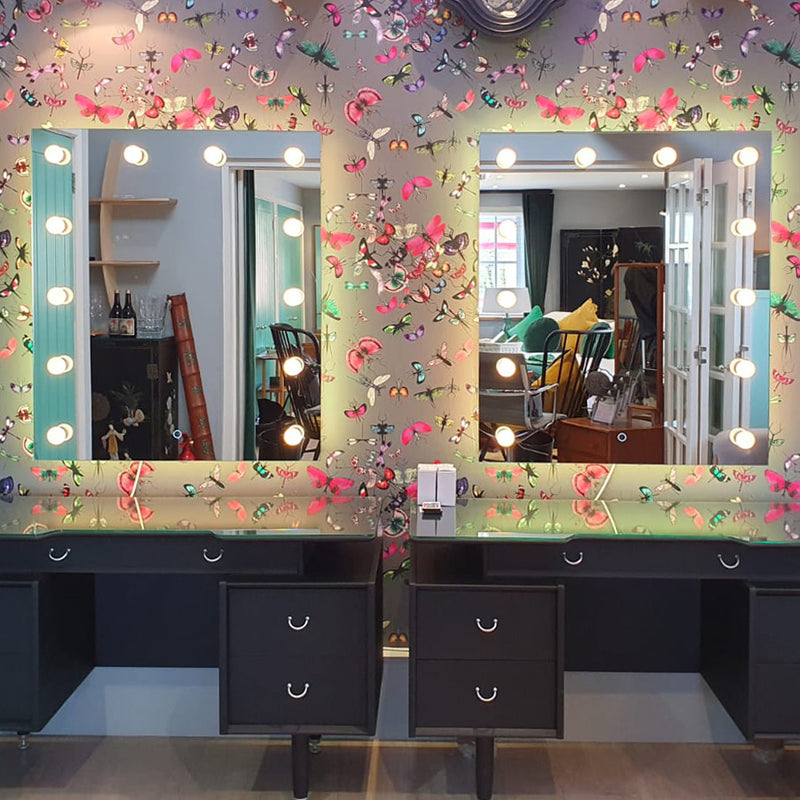 Two Hollywood mirrors add a touch of class to this bold and beautiful wall decor