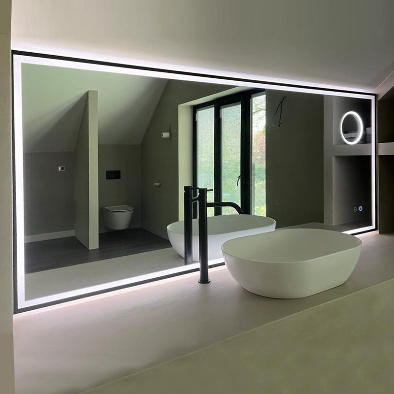 Made to measure edge-lit mirror with black metal frame and magnification mirror