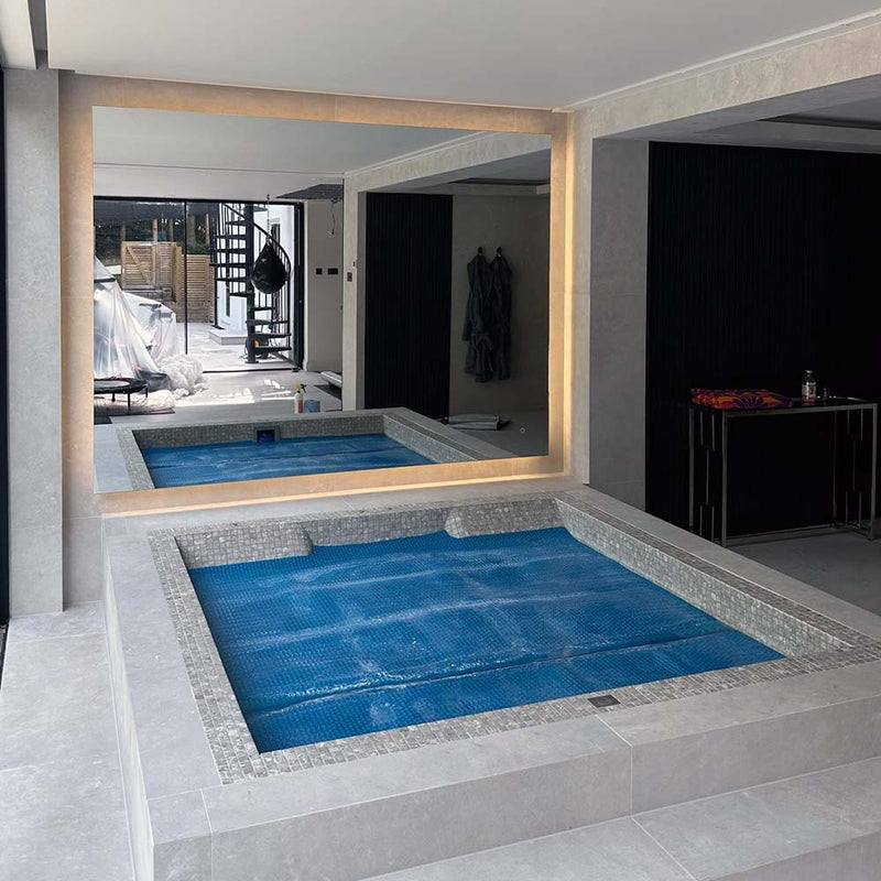 Oversized IP65 backlit mirror for this amazing indoor pool area