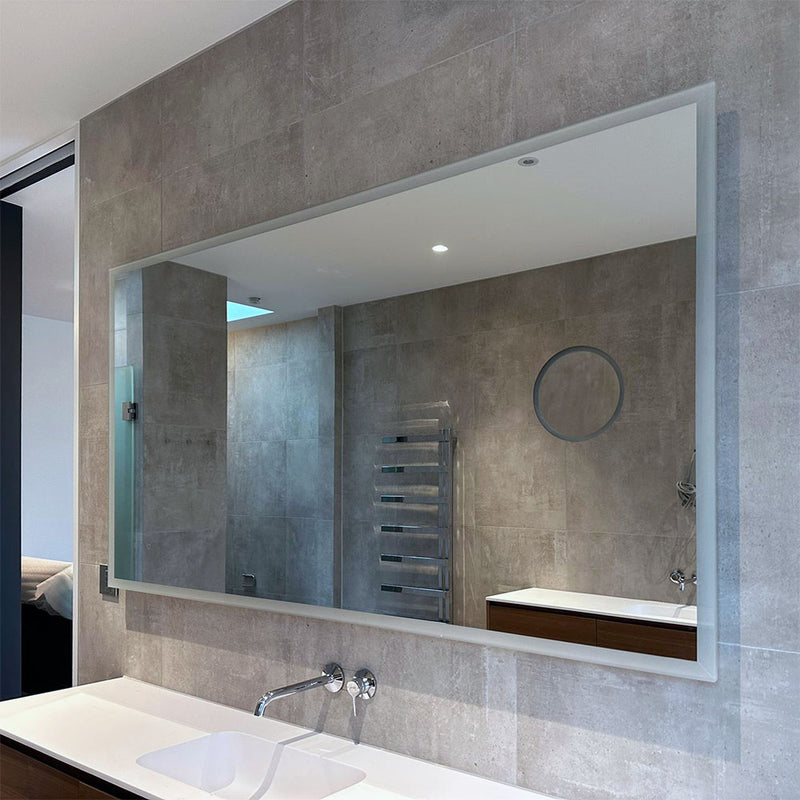 Edge-lit bathroom mirror with integrated 3x magnification mirror