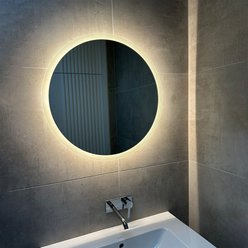 Frosted edge-lit mirror with integrated shaver socket