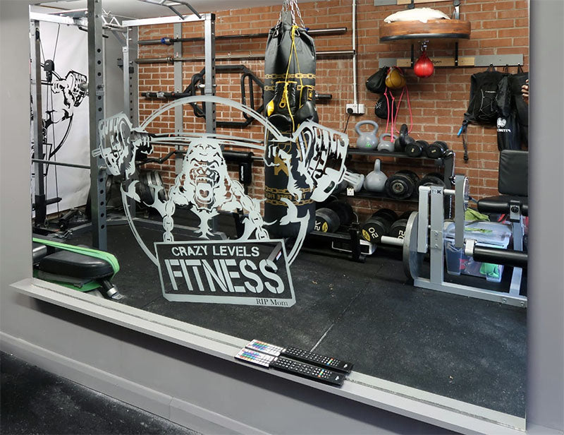Huge gym mirror with a custom backlit engraving for Crazy Levels Fitness.