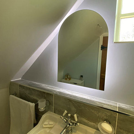 Simple backlit arch mirror.