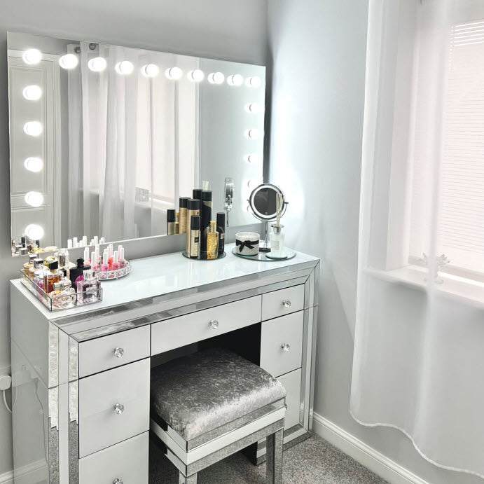 Naomi's large wall-mounted Hollywood mirror