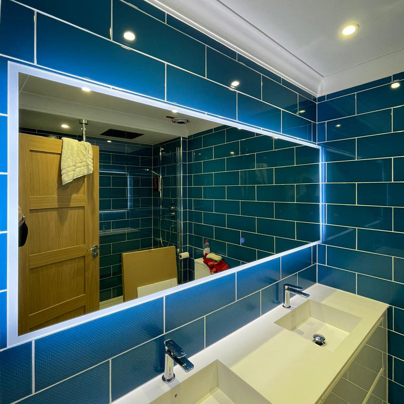 Large edge-lit mirror with touch sensor on/off control.