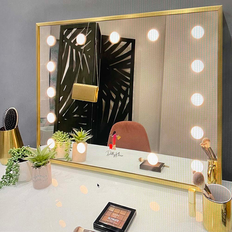 Hollywood mirror with a brass frame and custom printed touch sensor design