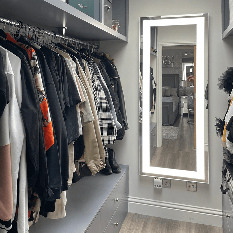 A full-length mirror is the perfect finishing touch for this walk-in wardrobe