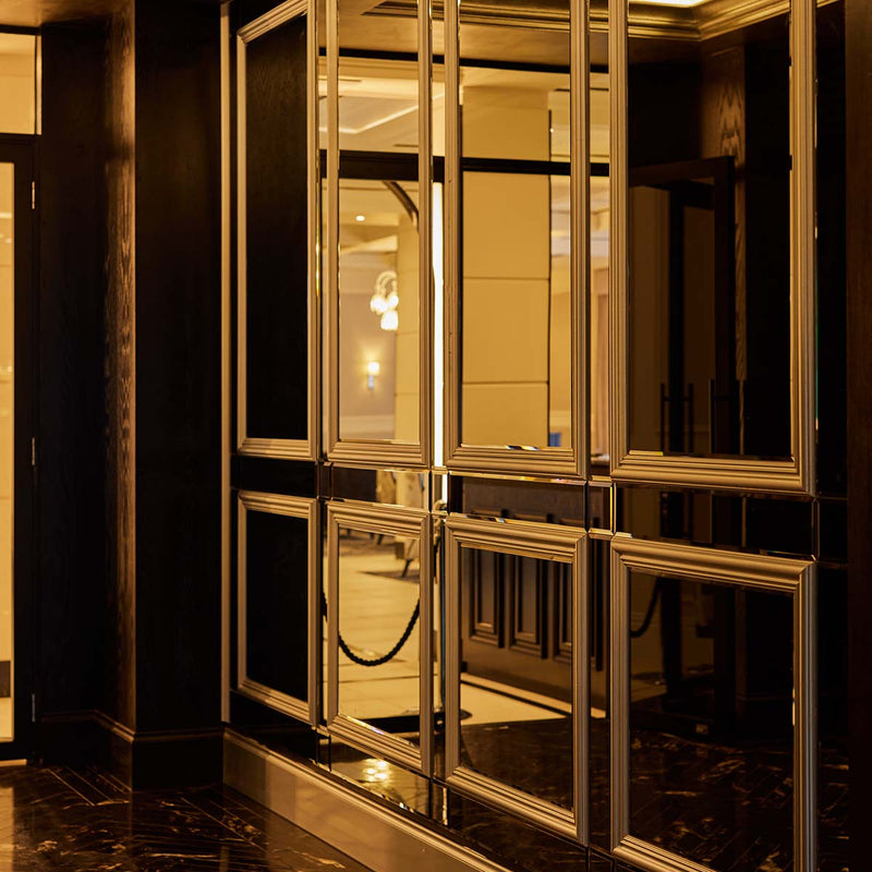Wainscoting with mirror panels exude luxury throughout the halls of the Fairmont