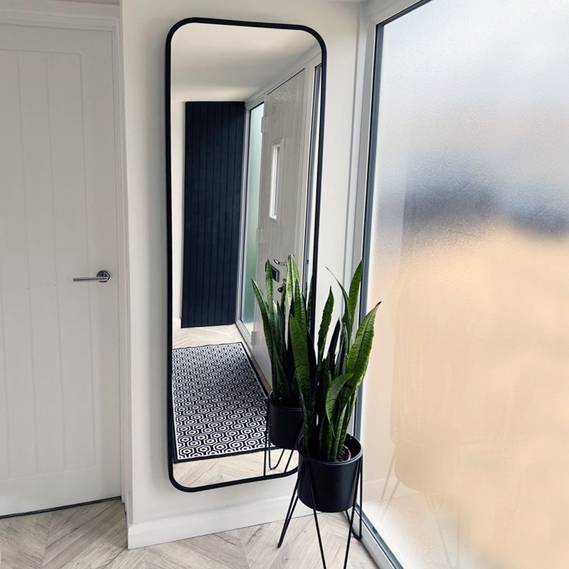 Tall, full-length black-framed mirror with radius corners