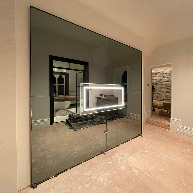 Handcrafted mirror feature wall panelling and built-in mirror at Crutchly Manor