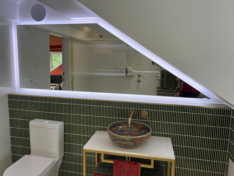 Edge lit trapezoid mirror