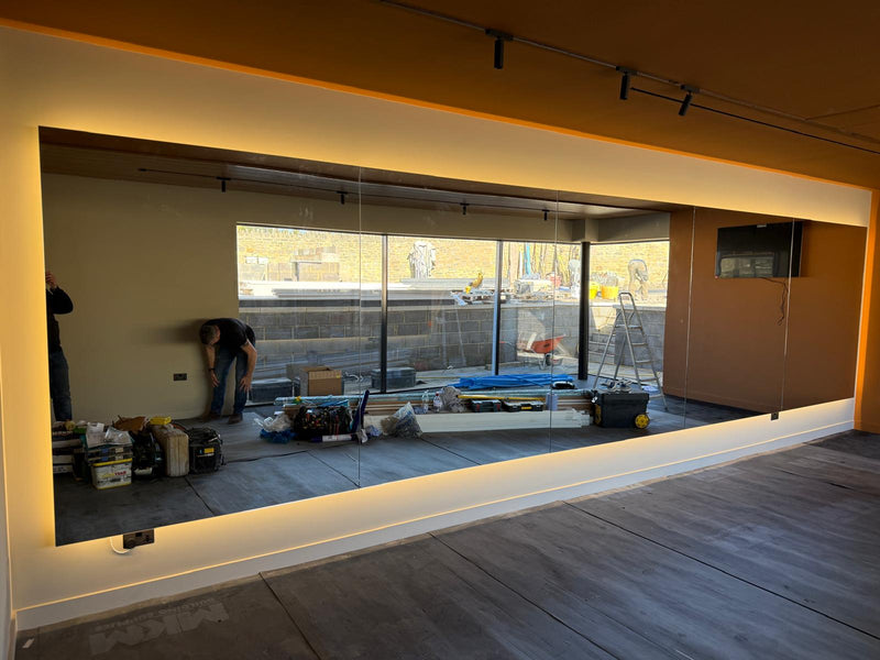 7 meter backlit mirror run. Installed by us btw!